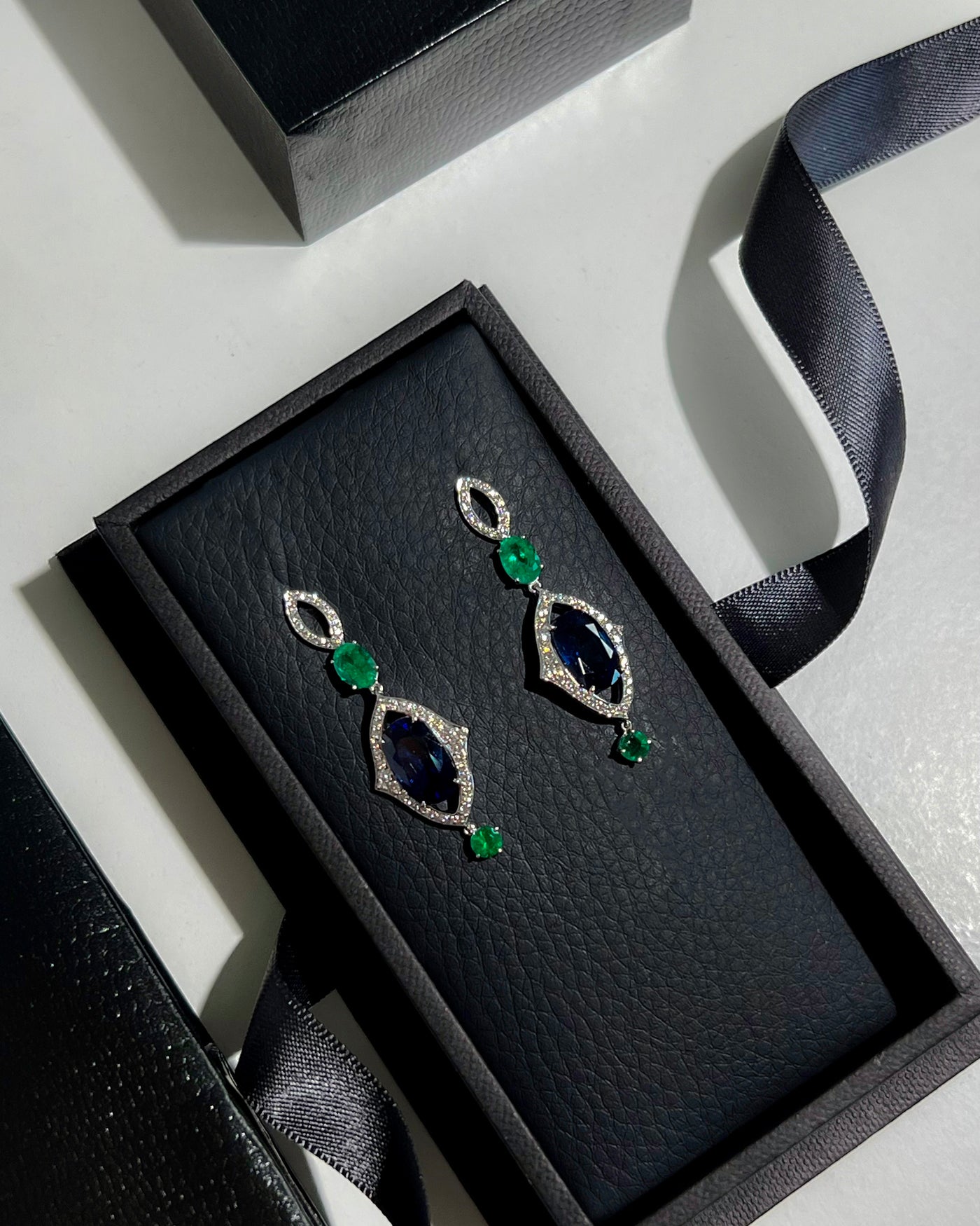 Blue Sapphire and Emerald Earrings in 18K White Gold